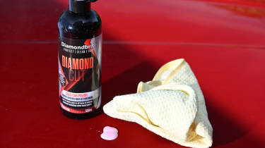 Auto Express products editor Tom Barnard polishing a Skoda Superb with Diamondbrite Diamond Cut